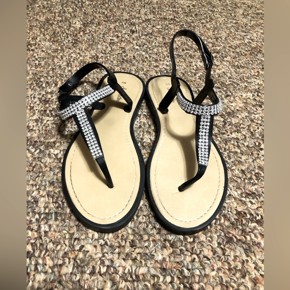 7/8 woman’s sandals with diamonds in front.